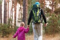 Father hiking with kid on backpack Royalty Free Stock Photo