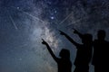 Father and his daughter are watching Meteor Shower. Night sky. Royalty Free Stock Photo