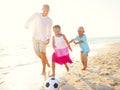 Father and his kids playing football together Royalty Free Stock Photo