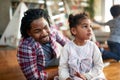 A father and his little daughter spending quality time at home together. Family, together, love, playtime