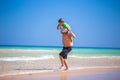Father and his little son having fun and running on the beach. Royalty Free Stock Photo