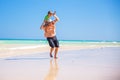 Father and his little son having fun and running on the beach. Royalty Free Stock Photo