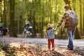 Father and his little son during the hiking activities in forest at sunset Royalty Free Stock Photo