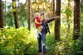 Father and his little son during the hiking activities in forest at sunset Royalty Free Stock Photo