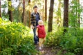 Father and his little son during the hiking activities in forest at sunset Royalty Free Stock Photo