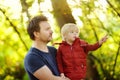 Father and his little son during the hiking activities in forest at sunset Royalty Free Stock Photo