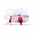 Father and his little son are playing football together in the yard. Royalty Free Stock Photo