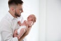 Father with his newborn son on background. Space for text Royalty Free Stock Photo
