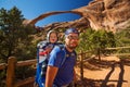 Father with his son in front of Landscape arch in Arches Natio Royalty Free Stock Photo