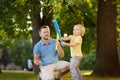 Father and his son playing baseball in park. Royalty Free Stock Photo