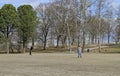 Father and his son are playing frisbee in park Royalty Free Stock Photo