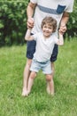 Father and his son playing and hugging in outdoors. Concept of Father`s day. Royalty Free Stock Photo