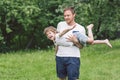 Father and his son playing and hugging in outdoors. Concept of Father`s day. Royalty Free Stock Photo