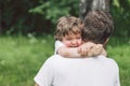 Father and his son playing and hugging in outdoors. Concept of Father`s day. Royalty Free Stock Photo