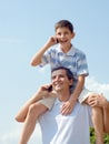 Father and his son are speaking over mobiles Royalty Free Stock Photo
