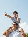 Father and his son are speaking over mobiles Royalty Free Stock Photo