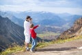 Father and his son taking pictures of mountais Royalty Free Stock Photo