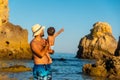 Father with his son on vacation at Praia dos Arrifes, Algarve beach, Portugal Royalty Free Stock Photo