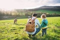 A father with his toddler son on a walk outside in spring nature. Royalty Free Stock Photo