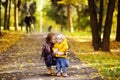 Father and his toddler son walking in autumn park Royalty Free Stock Photo