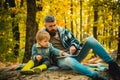 Father and his toddler son walking during the hiking activities in autumn forest. Active family time on nature. Fun with Royalty Free Stock Photo