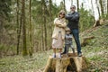 Father and his two kids hiking in the woods. Dad, his toddler son and teenage daughter having fun on a walking trail on spring day Royalty Free Stock Photo