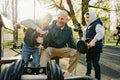 Father with his two sons on an outdoor sports ground in the park Royalty Free Stock Photo