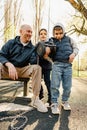 Father with his two sons on an outdoor sports ground in the park Royalty Free Stock Photo