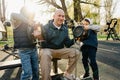 Father with his two sons on an outdoor sports ground in the park Royalty Free Stock Photo