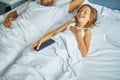 Father and Daughter Sleeping Peacefully Together in a Bright Bedroom During