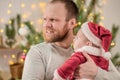 Father Holding A Baby Santa Claus Celebrate Christmas