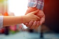 Father holding the daughter/ child hand behind the traffic lights. Royalty Free Stock Photo