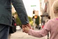 Father holding the daughter/ child hand behind the traffic lights Royalty Free Stock Photo