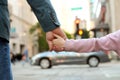 Father holding the daughter/ child hand behind the traffic lights Royalty Free Stock Photo