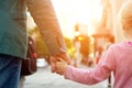 Father holding the daughter/ child hand behind the traffic lights. Royalty Free Stock Photo