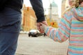 Father holding the daughter/ child hand behind the traffic lights. Royalty Free Stock Photo