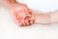 Father holding the hand of his new born son Royalty Free Stock Photo