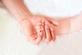 Father holding the hand of his new born son Royalty Free Stock Photo