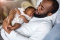 Father holding his baby in arms Royalty Free Stock Photo