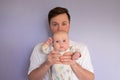 Father holding his baby girl at home Royalty Free Stock Photo