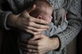 A father holding his baby son on his chest. Family bonding. Fatherhood Royalty Free Stock Photo