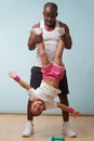 Father is holding his little daughter upside down at home Royalty Free Stock Photo