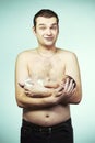 Father posing with his baby boy on chest for portrait Royalty Free Stock Photo