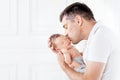 Father holding his newborn baby in  hands. Father kissing his baby Royalty Free Stock Photo