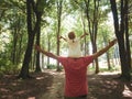 Father holding little girl daughter on his shoulder. Hands wide spread Royalty Free Stock Photo