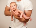 Father holding new born baby on his arm Royalty Free Stock Photo