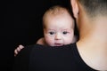 Father holding newborn baby