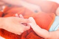 Father holding newborn baby hand. Happy Family concept. Beautiful conceptual image of Maternity, Newborn baby boy hand Royalty Free Stock Photo