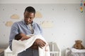 Father Holding Newborn Baby Son In Nursery Royalty Free Stock Photo