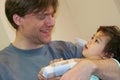 Father holding sick baby in hospital Royalty Free Stock Photo